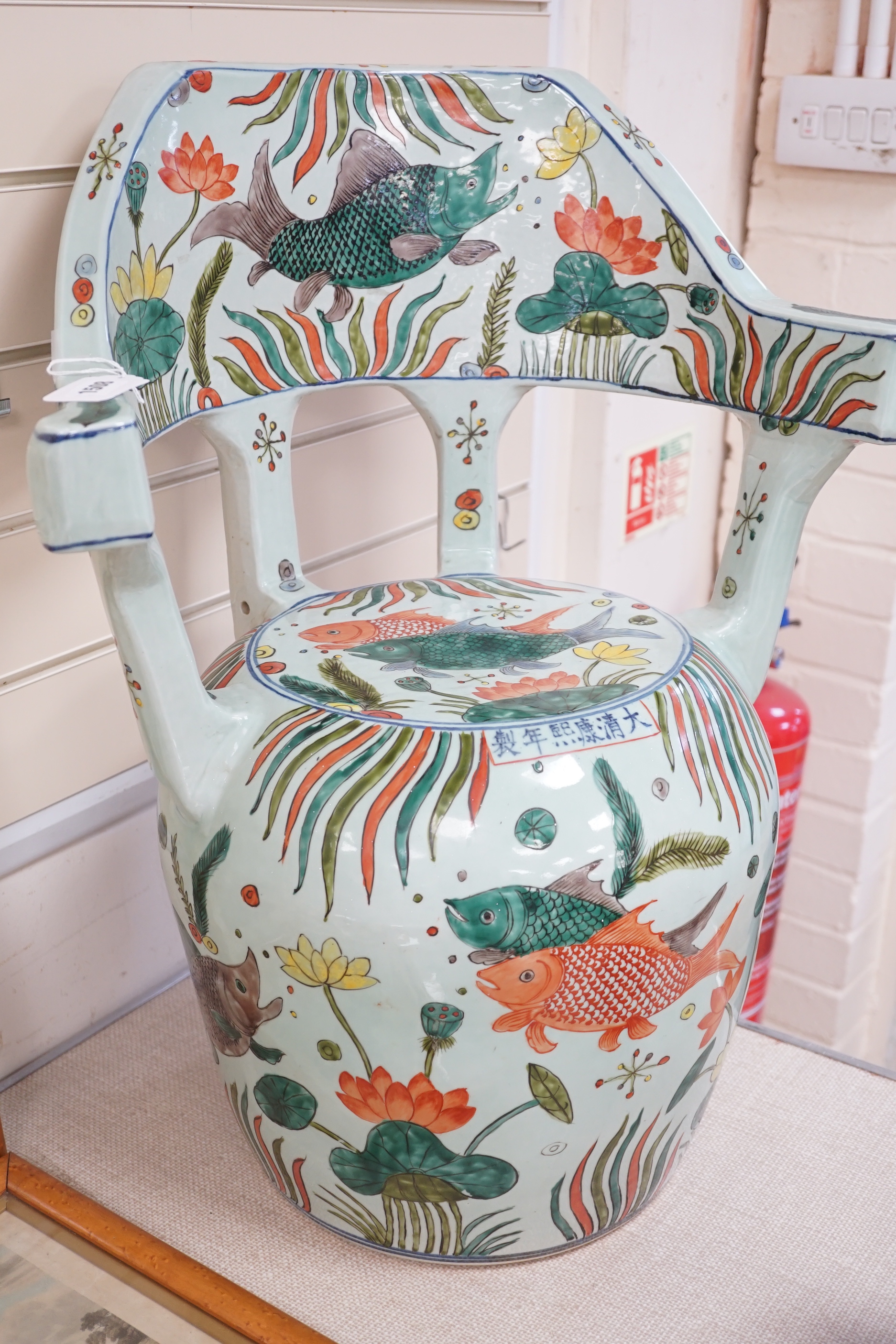 A Chinese famille verte porcelain ‘fish pond’ garden seat, 65cm high